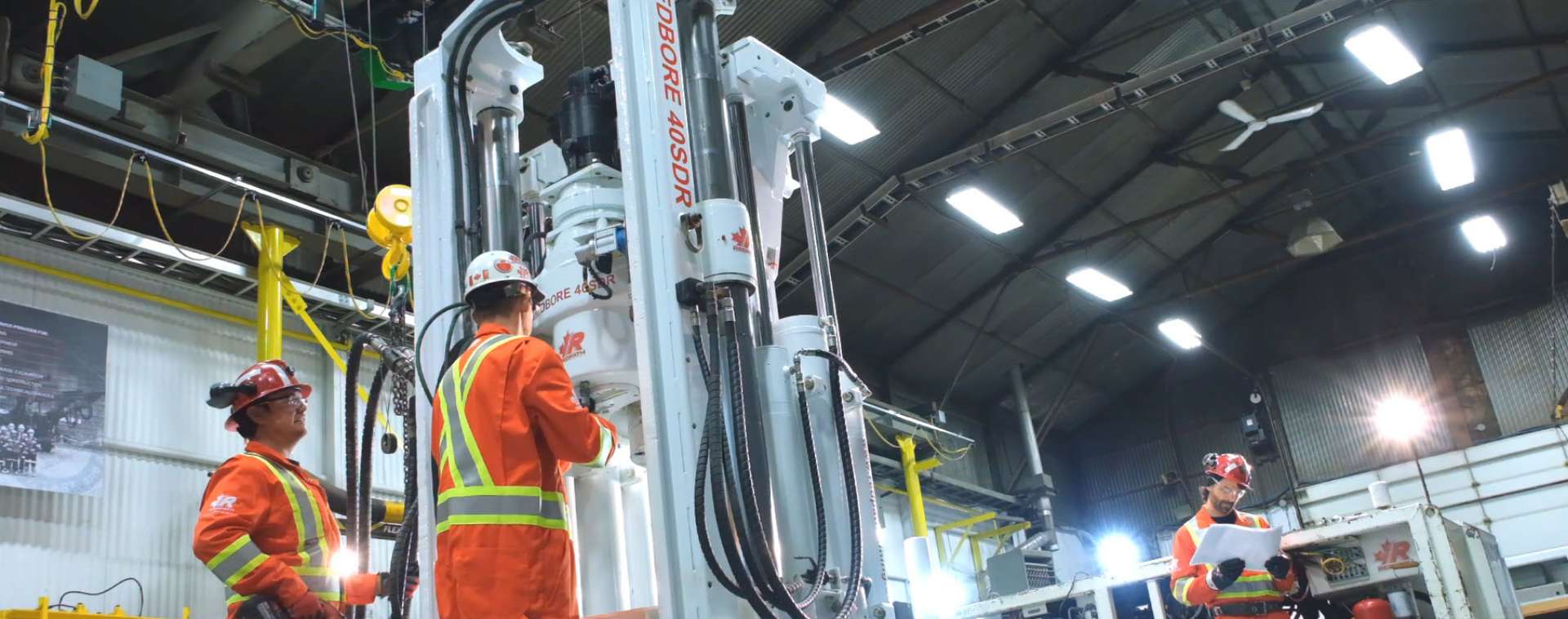 Redpath employees repairing a Redbore 40SDR raisebore drill at the raisebore global headquarters in North Bay, Ontario.